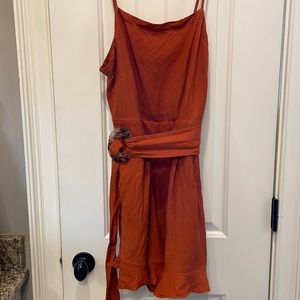 Loft size 10 burnt orange romper.  Pockets and ruffles, with cute belt!